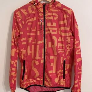 Reebok running jacket size medium pink and orange